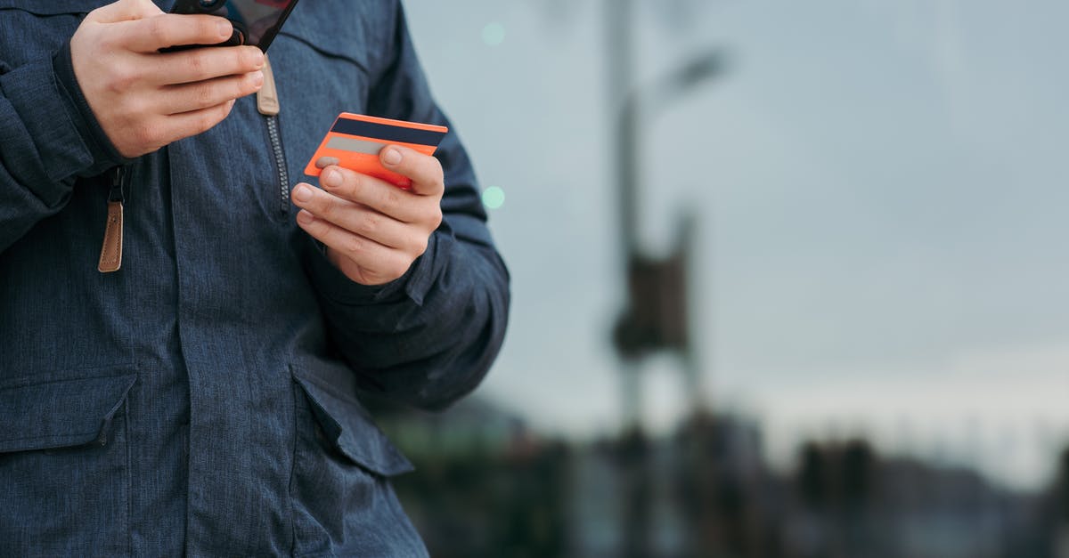 How does one use @e data on a custom named snowball - Male taking photo of credit card on smartphone on street in daytime How does one use @e data on a custom named snowball - Male taking photo of credit card on smartphone on street in daytime