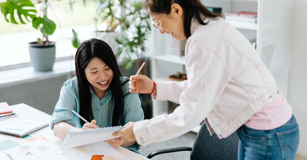 How does Overdrive work? - Woman in White Long Sleeve Shirt Holding White Paper