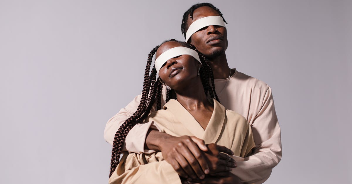 How does perception work? - Man in Beige Long Sleeves Shirt Hugging Woman Wearing Brown Coat Blindfolded How does perception work? - Man in Beige Long Sleeves Shirt Hugging Woman Wearing Brown Coat Blindfolded
