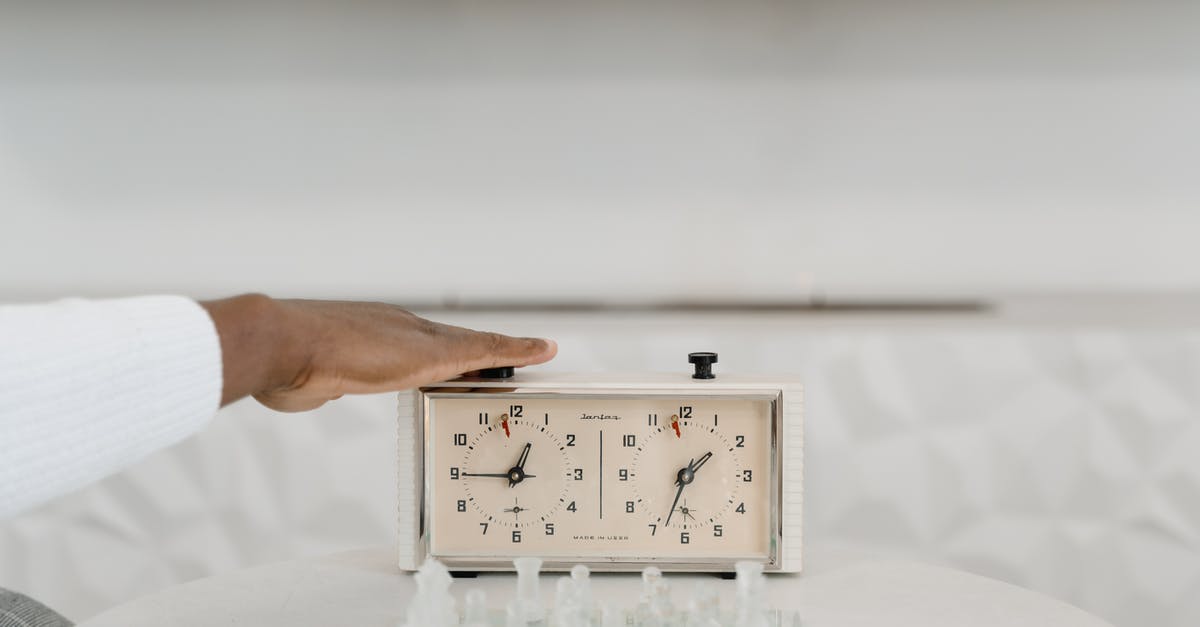 How does player respawn time work? - Person Holding White Analog Clock