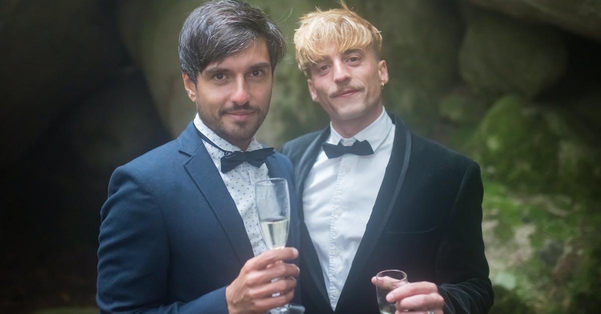 How does powerplay affect the major factions? - Man in Black Suit Jacket Holding Clear Drinking Glass