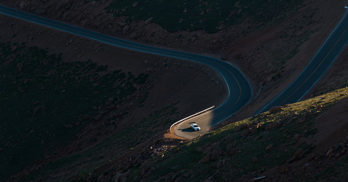 How does race day work? - Aerial View of Road in the Middle of Green Trees