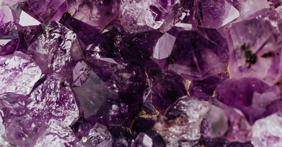 How does re-fertilizer work regarding rocks? - Set of shiny transparent amethysts grown together