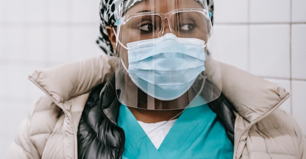 How does Shield Bash (Shattered Shield) work? - Crop black nurse in outerwear mask and face shield How does Shield Bash (Shattered Shield) work? - Crop black nurse in outerwear mask and face shield