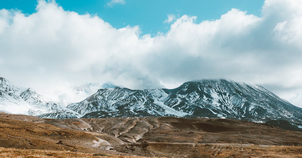 How does Stun (stun extradamage) and battlefury stack? - Scenic snowy mountains with peaks hiding in fluffy clouds