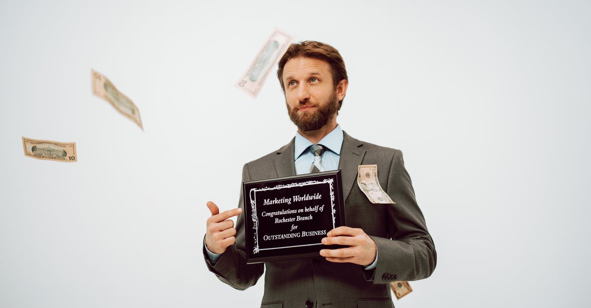How does the 'High Caliber' award work? - A Man in the Business Suit Holding a Black Plaque How does the 'High Caliber' award work? - A Man in the Business Suit Holding a Black Plaque