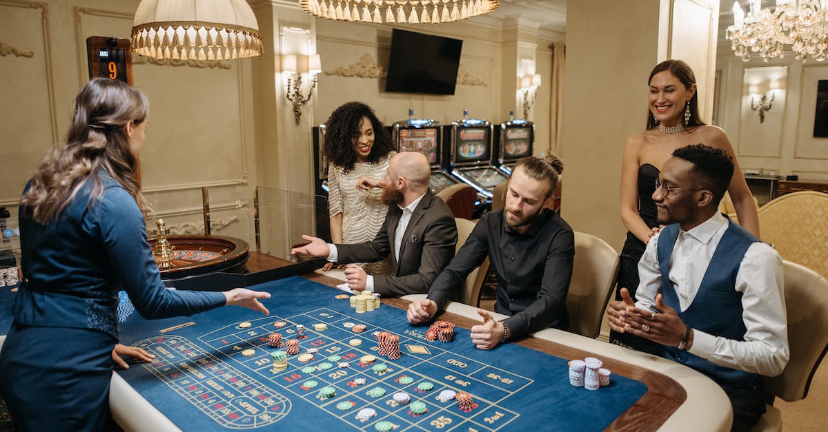 How does the betting work? - Group of Gamblers Playing on Roulette Table How does the betting work? - Group of Gamblers Playing on Roulette Table