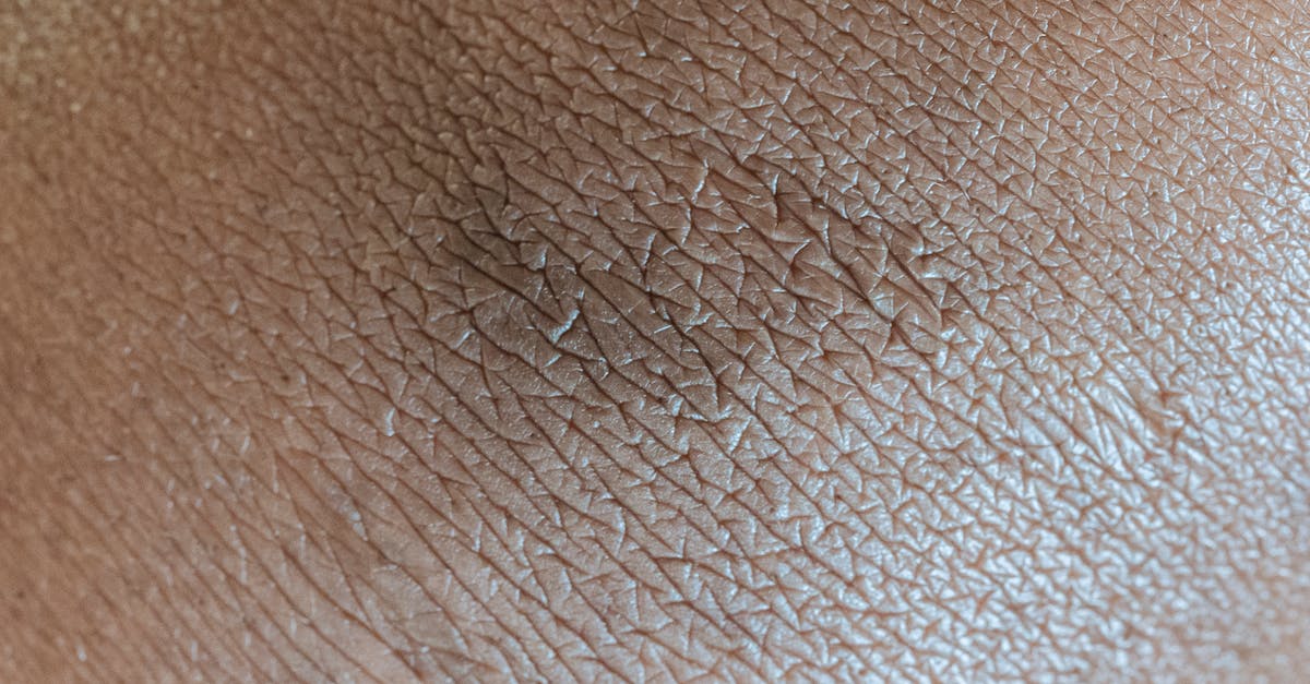 How does the elemental DoT of two weapons of the same element stack? - Textured background of skin surface with linear pattern and pigmentation spot in center