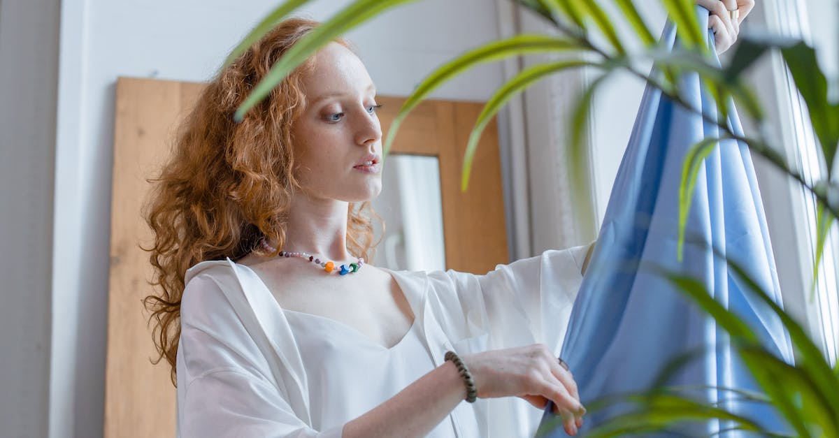 How does the exp work? - Woman in White Long Sleeve Shirt Holding Blue Curtain How does the exp work? - Woman in White Long Sleeve Shirt Holding Blue Curtain