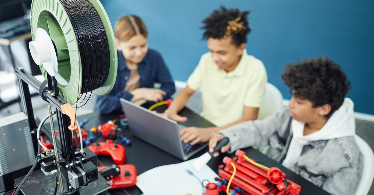 How does the Forgotten tech Learn From Others work? - Group of focused children using laptop