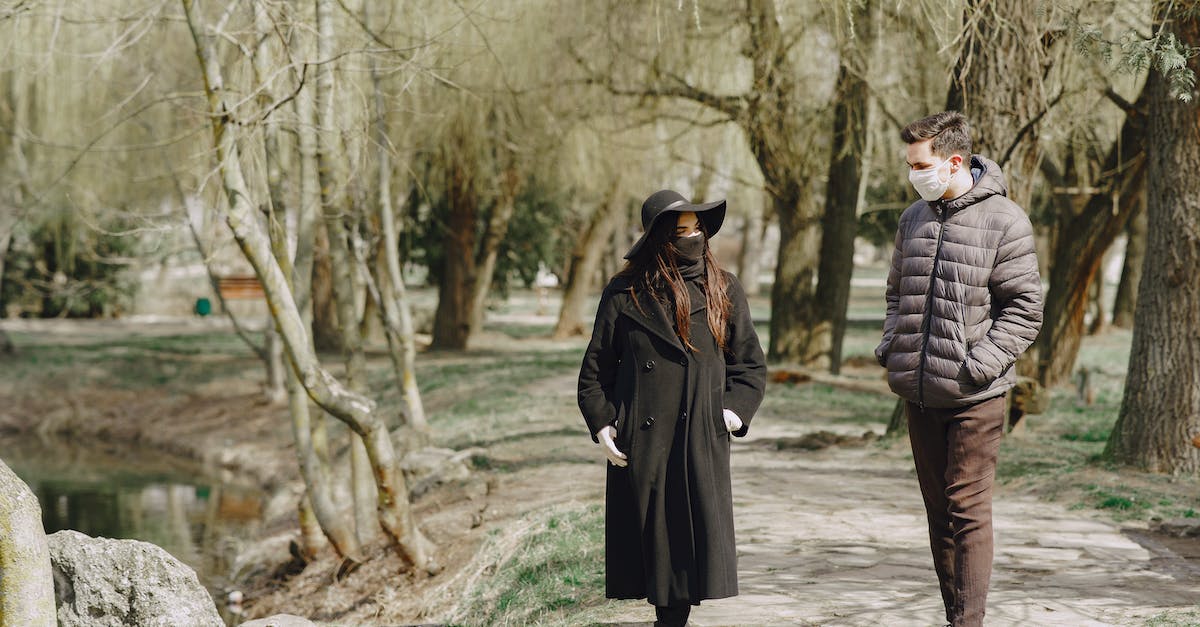 How does the frenzy virus affect other monsters? - Young couple walking in protective masks in park