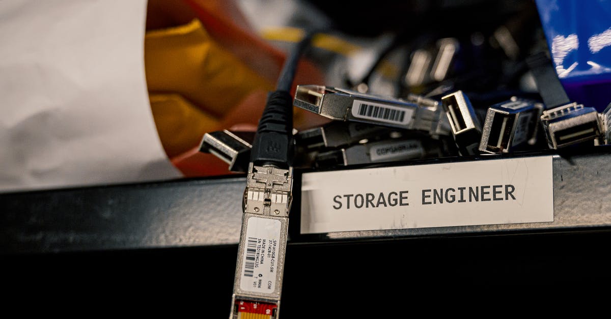 How does the save system of the Konami Castlevania Anniversary Collection work? - Low angle of various connectors and USB cables placed on shelf with storage engineer inscription