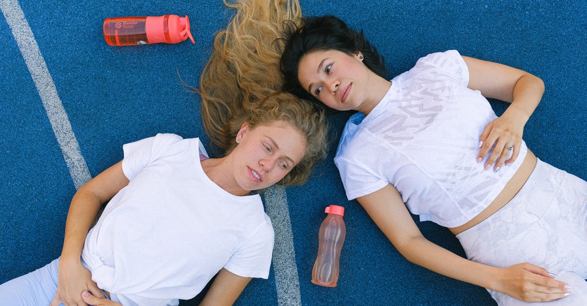 How does the trainer level affect powering up Pokemon? - Young female athletes having break during workout in sport club