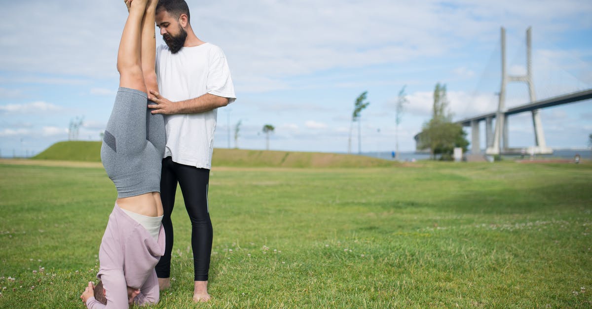 How does training work? - Woman in White Shirt and Black Leggings Standing on Green Grass Field How does training work? - Woman in White Shirt and Black Leggings Standing on Green Grass Field