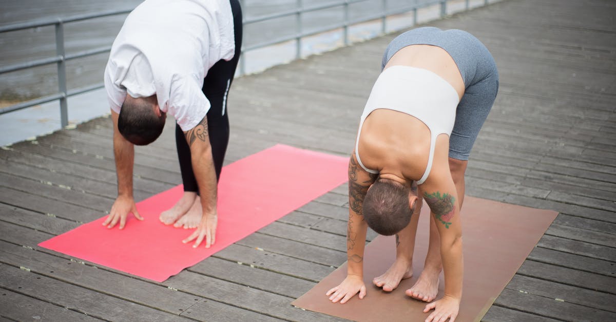How does training work? - Woman in White Tank Top and Gray Leggings Doing Yoga on Pink Yoga Mat How does training work? - Woman in White Tank Top and Gray Leggings Doing Yoga on Pink Yoga Mat