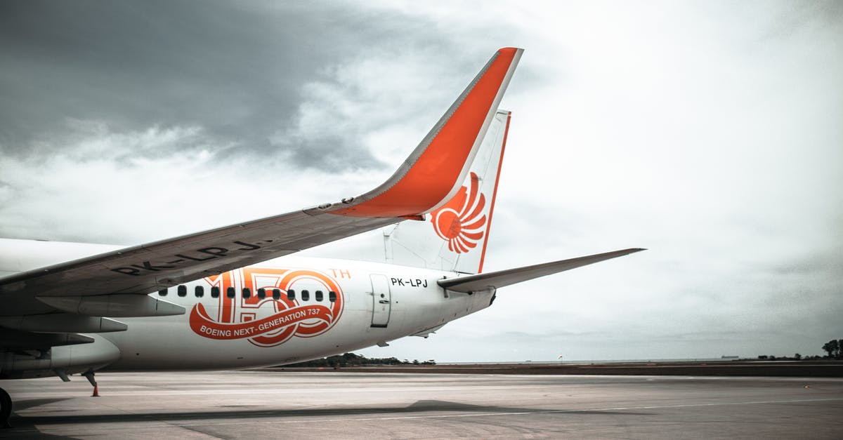 How does traveling to a wing member work? - Parked White and Orange Airplane How does traveling to a wing member work? - Parked White and Orange Airplane