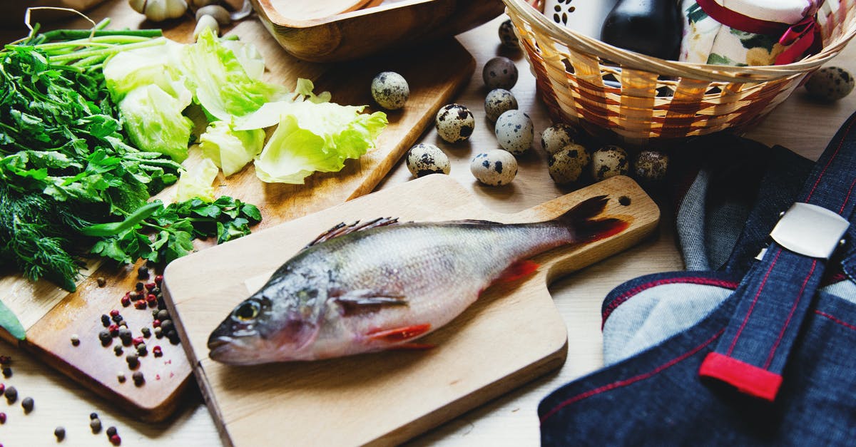 How does Vivi differ from other Black Mages? - Raw fish on cutting board with lettuce in kitchen How does Vivi differ from other Black Mages? - Raw fish on cutting board with lettuce in kitchen