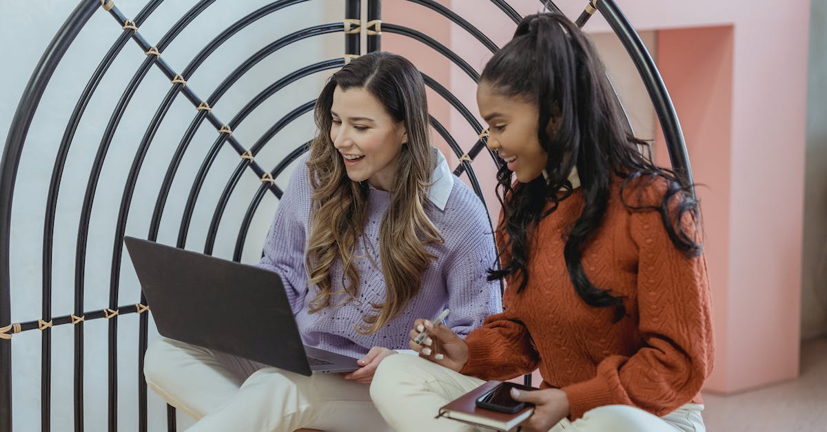How does Xbox friend request work cross platform? - Cheerful diverse women using laptop on floor How does Xbox friend request work cross platform? - Cheerful diverse women using laptop on floor
