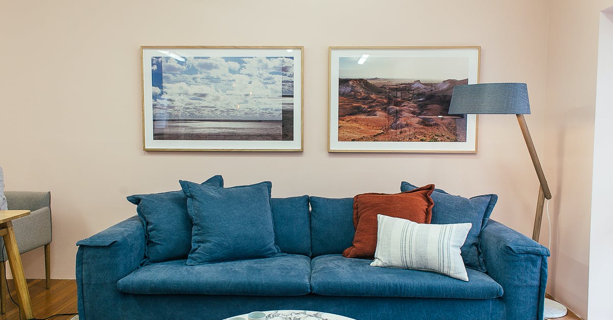 How exactly do you unlock new artes? - Big comfortable blue sofa with soft cushions placed in modern living room with round marble table near wall decorated with framed pictures How exactly do you unlock new artes? - Big comfortable blue sofa with soft cushions placed in modern living room with round marble table near wall decorated with framed pictures