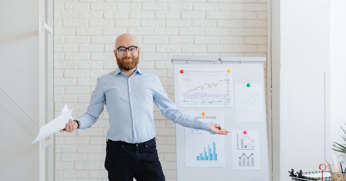 How exactly does the Tapper work? - Man in Blue Dress Shirt and Black Pants Standing Beside Whiteboard