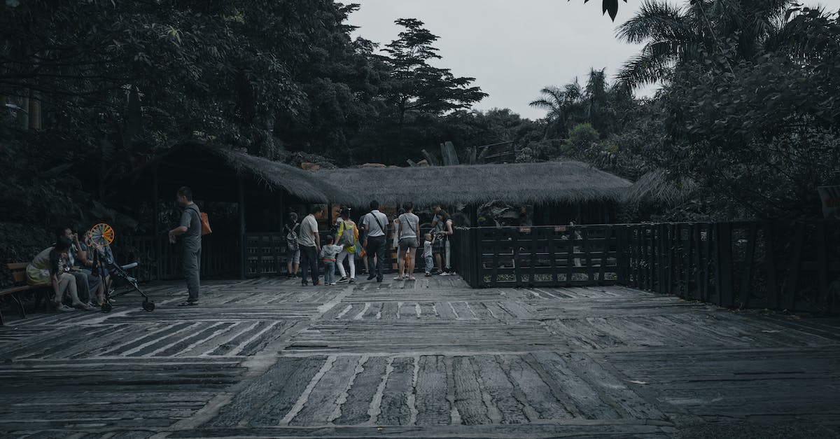 How fast does a person grow old, in in-game time? - Group of anonymous ethnic travelers on rough pavement against aged house and overgrown trees in summer How fast does a person grow old, in in-game time? - Group of anonymous ethnic travelers on rough pavement against aged house and overgrown trees in summer