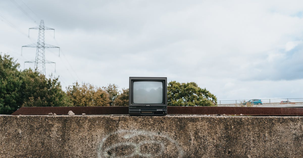 How frequent do you have to use powered rails uphill? - Small vintage TV set on stone fence