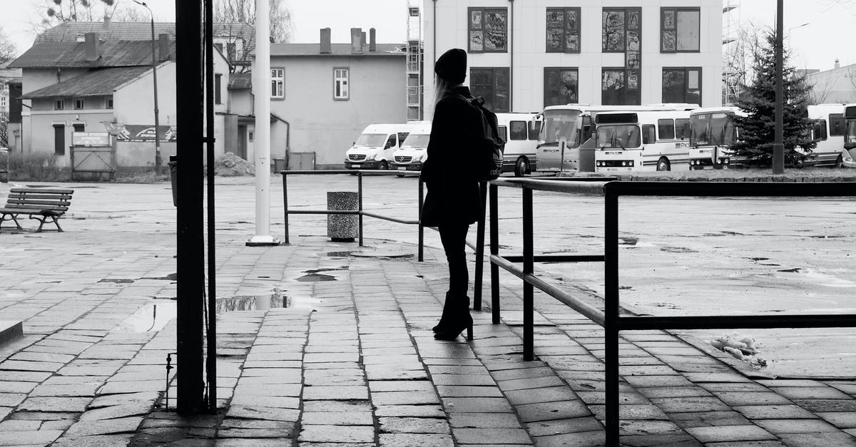 How I get some pokéstops in my town? [duplicate] - Grayscale Photo of Man in Black Jacket and Pants Walking on Sidewalk