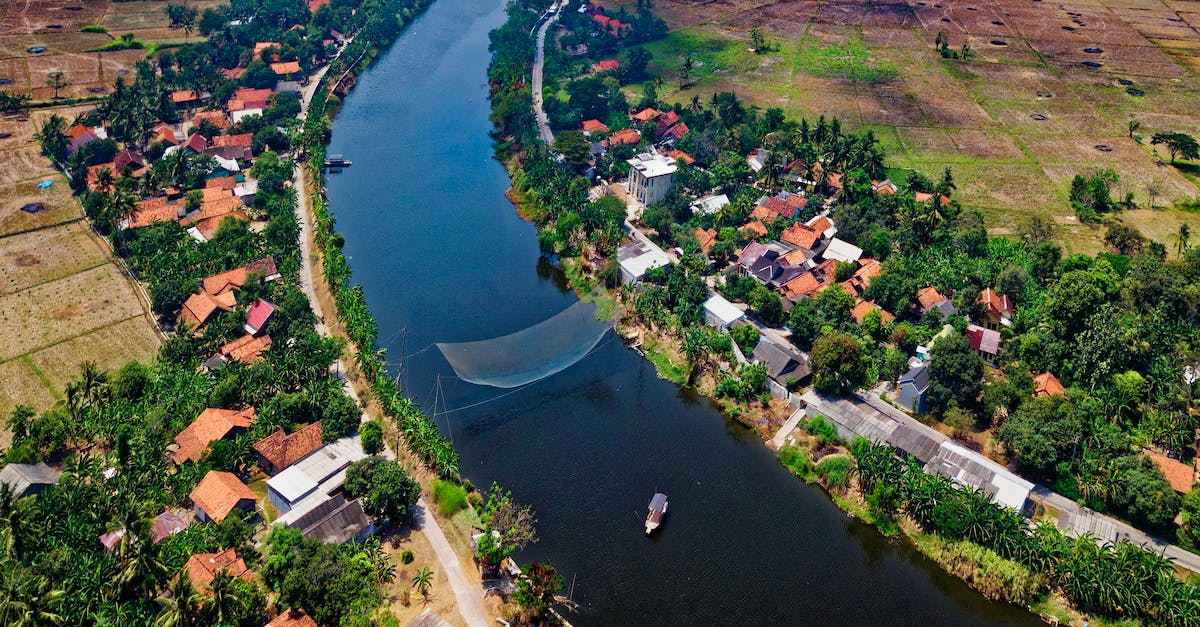 How is a hero's Net Worth calculated? - Calm Body of Water in Between Trees