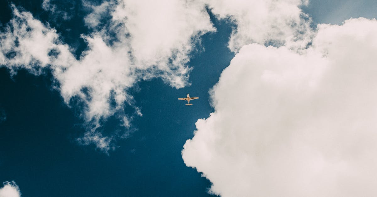 How is engine thrust calculated in environments with atmospheres greater than 1 atm? - From below of modern aircraft flying in blue sky amidst floating white fluffy cumulus clouds on sunny day How is engine thrust calculated in environments with atmospheres greater than 1 atm? - From below of modern aircraft flying in blue sky amidst floating white fluffy cumulus clouds on sunny day