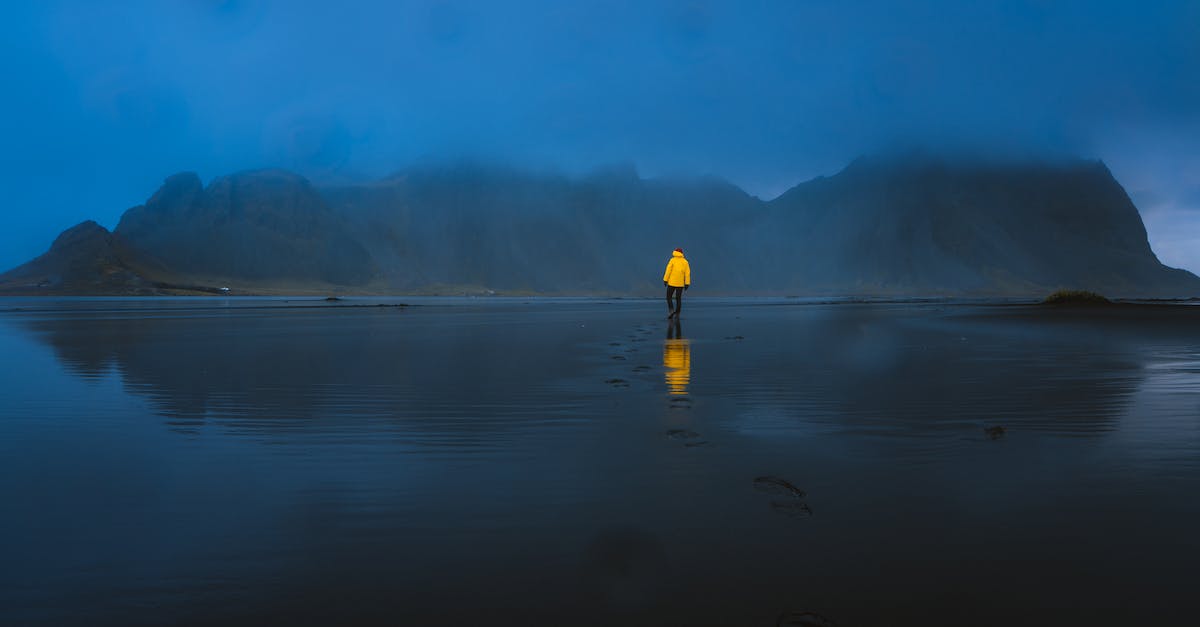How is infinifactory's footprint calculated? - Person Standing on Body of Water Near Island
