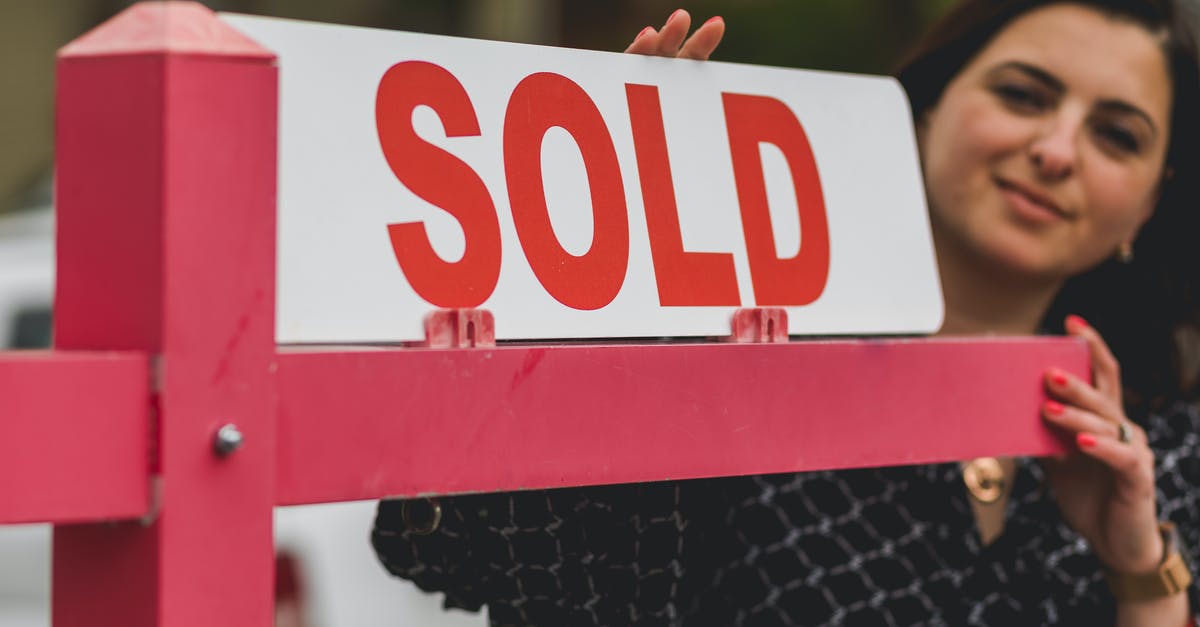 How is portal ownership decided? - Real Estate Agent Holding a Signage