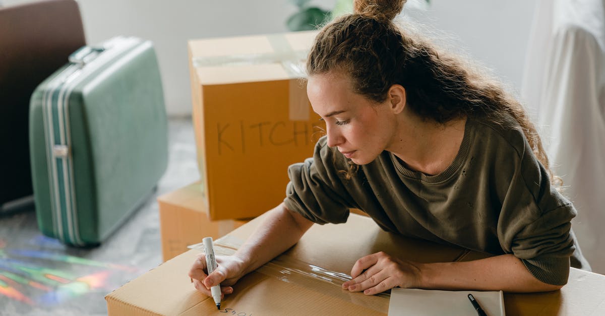 How is the new 3DS different from the previous 3DS? - Top view of thoughtful lady in casual wear writing with marker on cardboard box while sitting near suitcases and pile of boxes in light living room How is the new 3DS different from the previous 3DS? - Top view of thoughtful lady in casual wear writing with marker on cardboard box while sitting near suitcases and pile of boxes in light living room