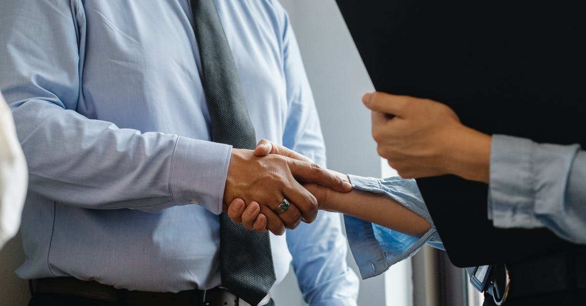 How is the Prestige Leader chosen if heroes are tied? - Crop anonymous man in formal shirt and tie shaking hand of woman with black folder while meeting in office How is the Prestige Leader chosen if heroes are tied? - Crop anonymous man in formal shirt and tie shaking hand of woman with black folder while meeting in office