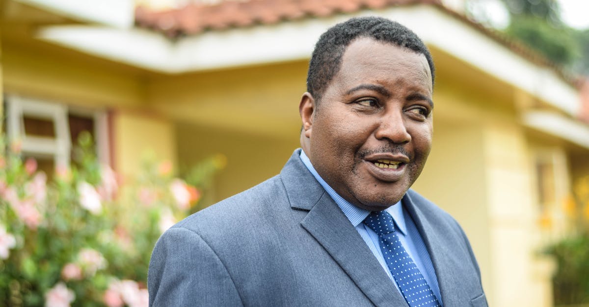 How is the Prestige Leader chosen if heroes are tied? - Cheerful black businessman standing near building How is the Prestige Leader chosen if heroes are tied? - Cheerful black businessman standing near building