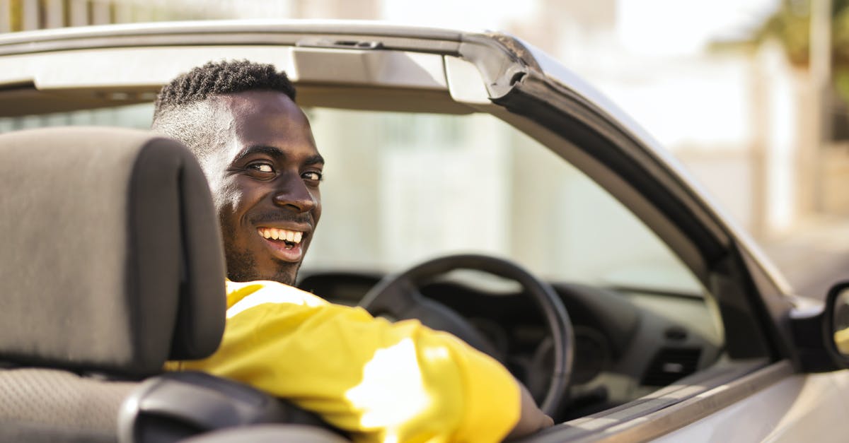 How is the Wii Wheel detected? - Man in Yellow Shirt Driving A White Luxury Car