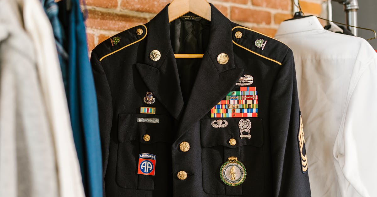 How is XP awarded for combat? - Photo of Military Uniform Hanging on a Rack
