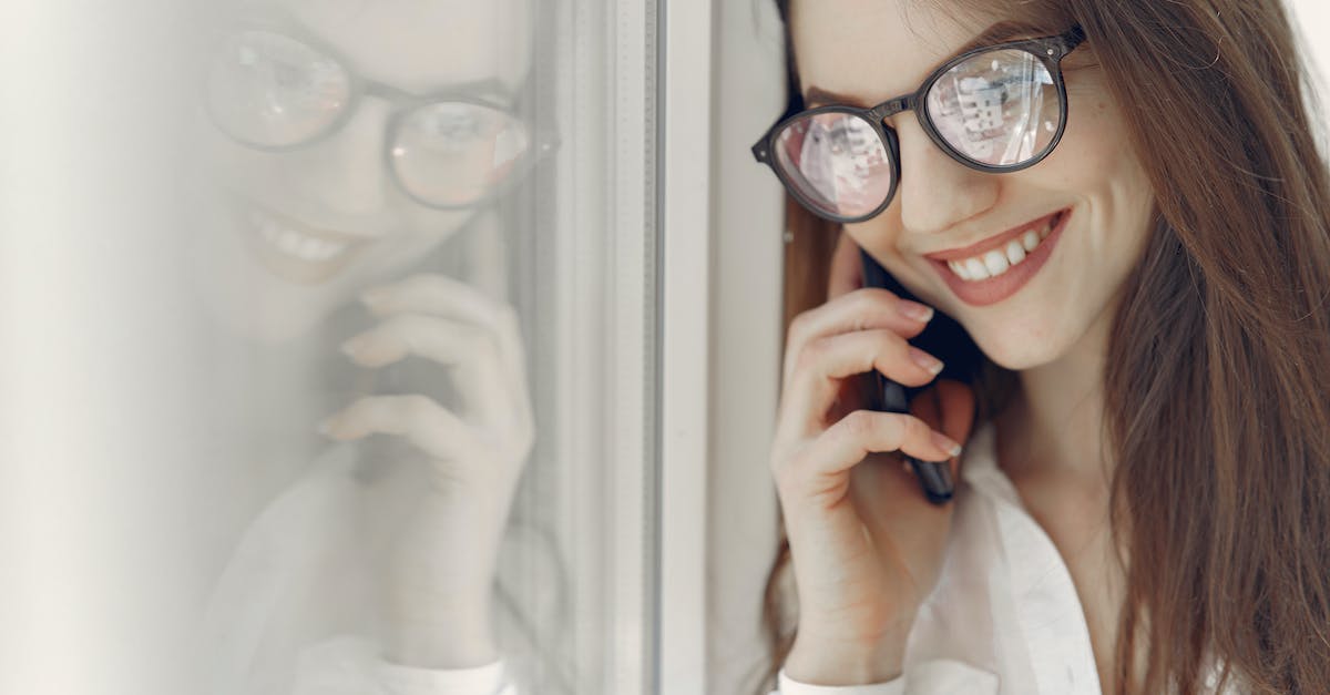 How long do I need to wait to reconnect to the pokemon bank after it is "locked" due to interrupted communication? - Happy young woman speaking on smartphone near window