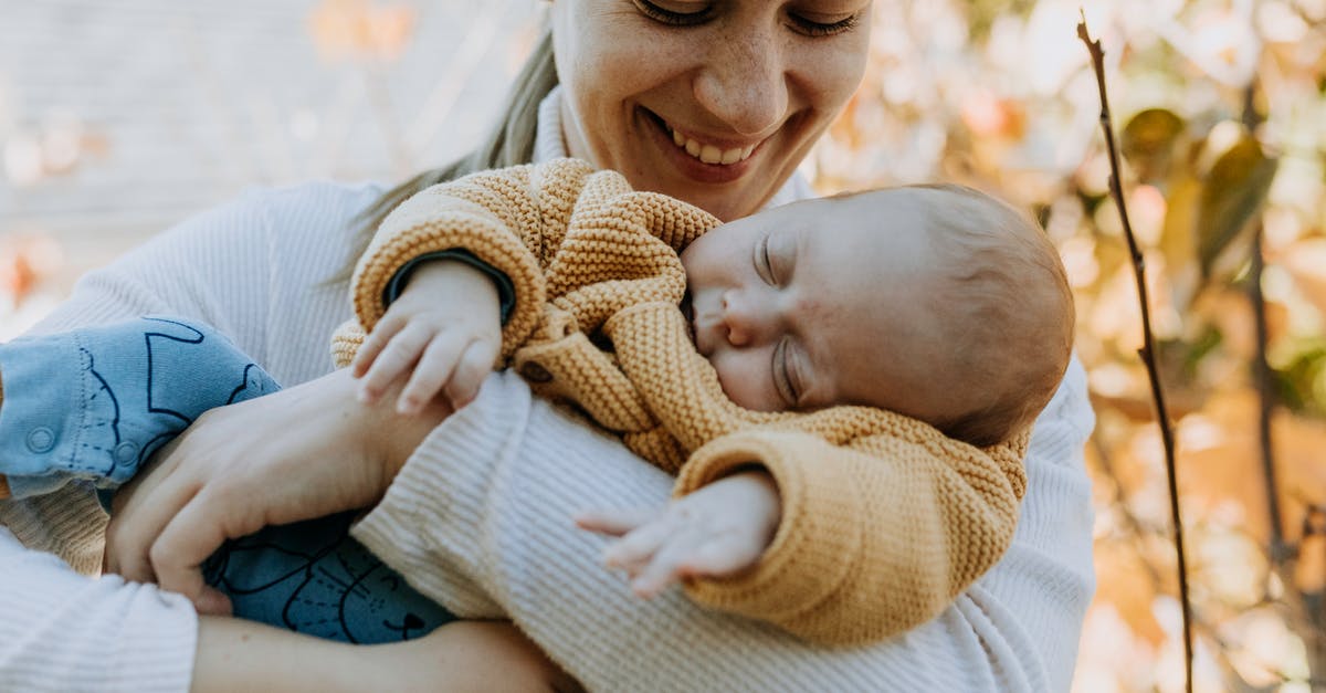 How long do sleeping bonuses last? - Smiling Woman Looking at her Sleeping Baby