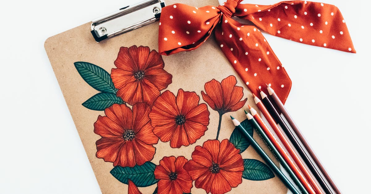 How long does it take to fully draw a bow in Minecraft? - Overhead view of long multi colored pencils and red polka dot bow with ribbon on carton clipboard decorated with picture of red flowers with green leaves on white background