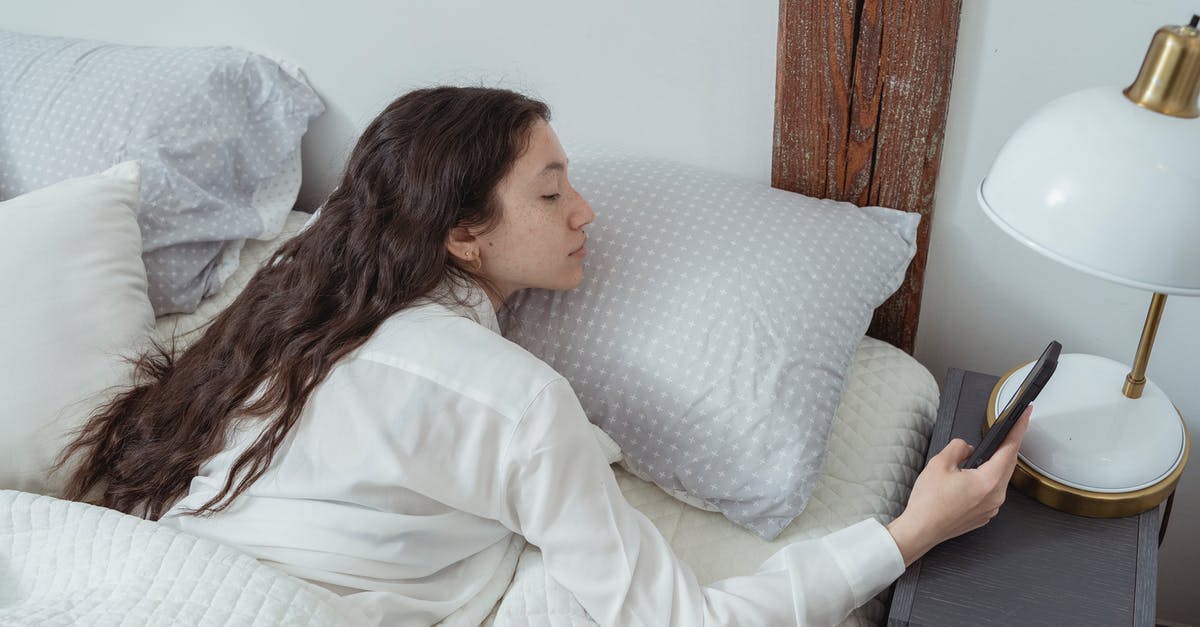 How long does Lazy Mushroom last? - Side view of young brunette with long hair in white nightwear lying on belly in comfortable bed under blanket and using mobile phone in morning at home How long does Lazy Mushroom last? - Side view of young brunette with long hair in white nightwear lying on belly in comfortable bed under blanket and using mobile phone in morning at home