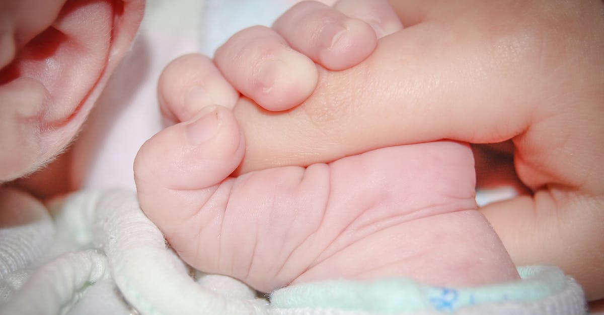 How long does life support last indoors? - Touching moment of crop anonymous newborn infant with tiny hand lying on soft bed and gently grasping parents finger How long does life support last indoors? - Touching moment of crop anonymous newborn infant with tiny hand lying on soft bed and gently grasping parents finger