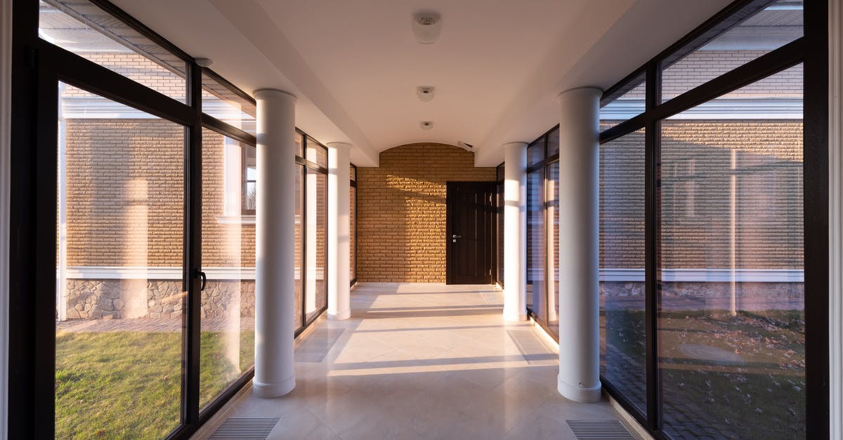 How long does the new dwellers queue last? - Corridor of modern building with glass walls How long does the new dwellers queue last? - Corridor of modern building with glass walls