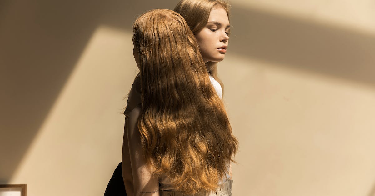 How long would it take to beat Minecraft with 3 people? [closed] - A Person with Long Blond Hair Standing Close to a Woman