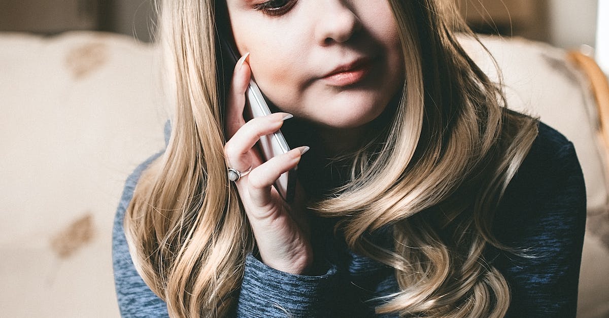 How long would it take to beat Minecraft with 3 people? [closed] - Woman in Gray Top Using Her Mobile Phone