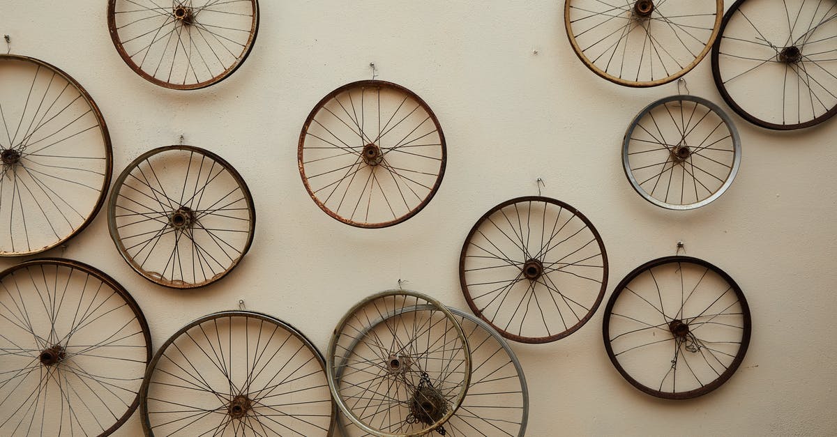 How many agents are active characters? - Different shapes and sizes spoke wheels hanging on light wall