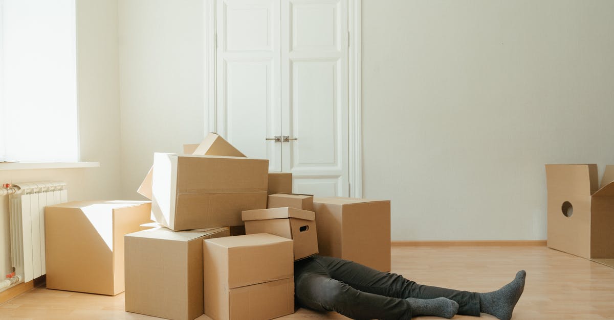 How many copies of Jackbox Party Pack 3 are needed for two households? - Person in Black Leather Boots Lying on Brown Cardboard Boxes How many copies of Jackbox Party Pack 3 are needed for two households? - Person in Black Leather Boots Lying on Brown Cardboard Boxes