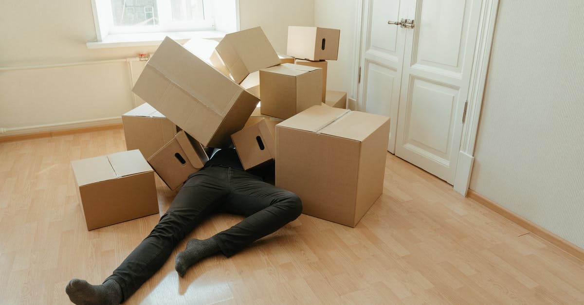 How many copies of Jackbox Party Pack 3 are needed for two households? - Person in Black Pants Lying on Brown Cardboard Boxes How many copies of Jackbox Party Pack 3 are needed for two households? - Person in Black Pants Lying on Brown Cardboard Boxes