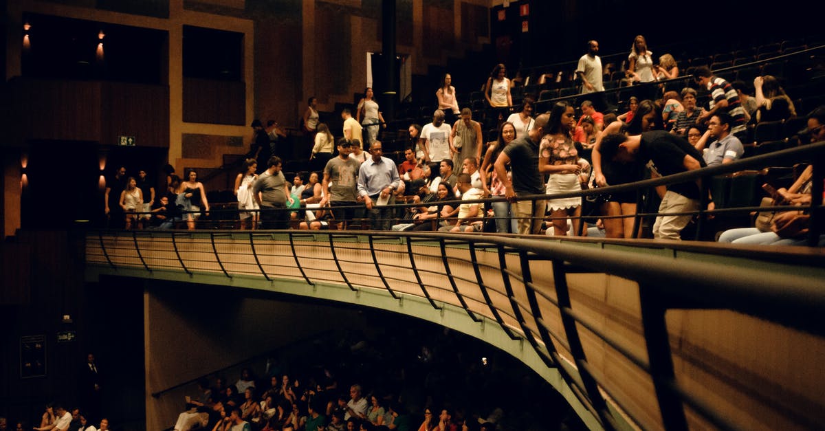 How many crew members sit inside each unit in Homeworld and Deserts of Kharak? - Crowd of people sitting on seats in balcony near metal barrier while waiting for performance in modern spacious concert hall