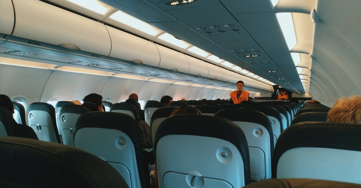 How many crew members sit inside each unit in Homeworld and Deserts of Kharak? - Inside of modern airplane cabin with passengers sitting on comfortable seats and cabin crew standing at passageway