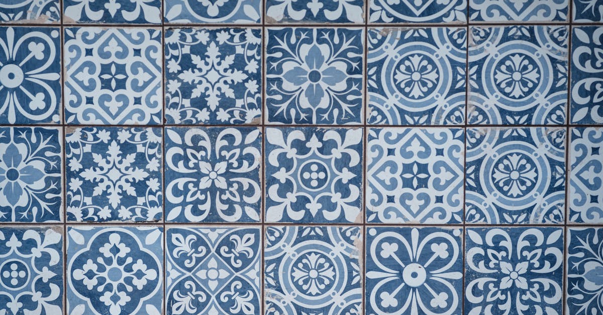 How many doomed units does each square take to corrupt? - Aged wall covered with ceramic square shaped tile with many blue different ornaments